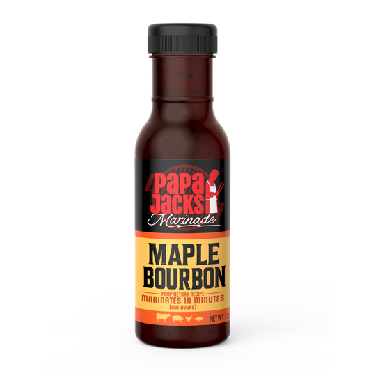 Papa Jack's Marinades Maple Bourbon bottle. The label is dark with bold red and white text for the brand name, and the product name, 'Maple Bourbon,' is displayed in black on a gold background. The text at the bottom reads, 'Marinates in minutes,' emphasizing quick preparation.